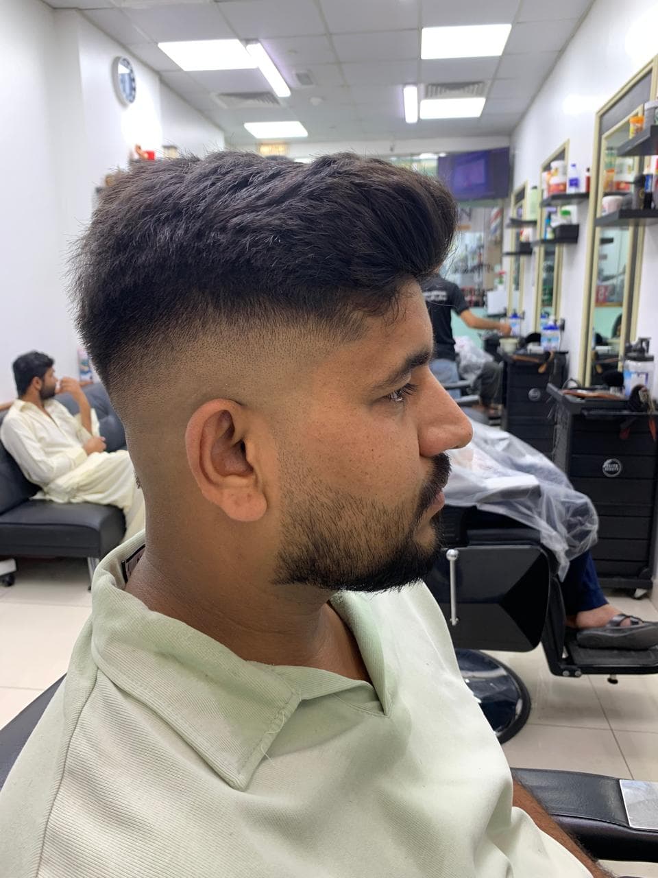 Fresh skin fade profile haircut inside the salon